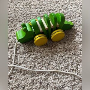 PlanToys Dancing Alligator wooden pull along toy.